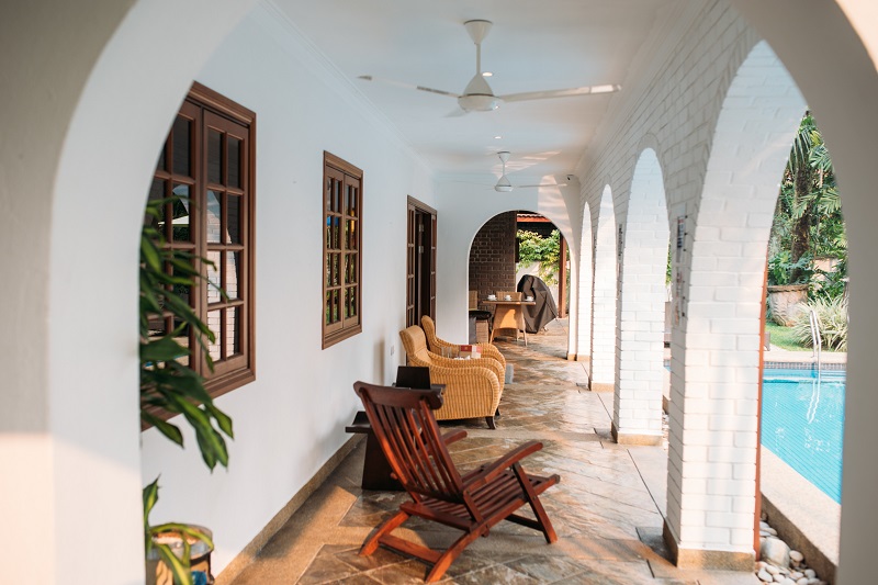 Poolside of older tropical home