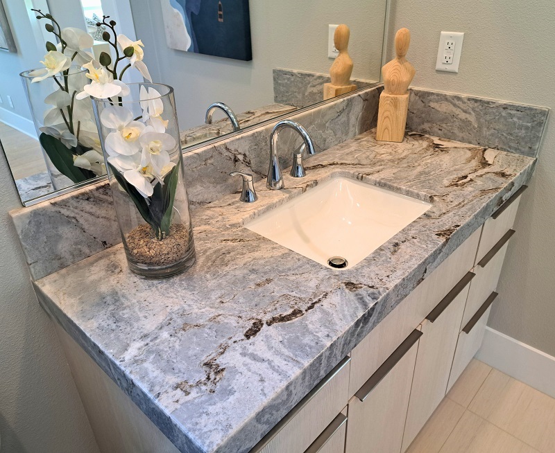 Bathroom with small vanity and upgraded countertop