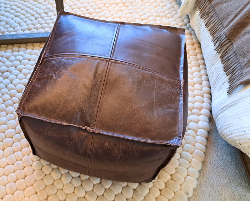 Comfortable flexible leather stool for a rec room