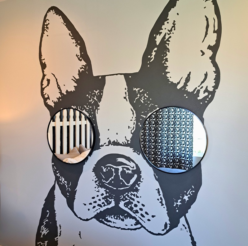 Large dog mural with mirror eyes, in rec room