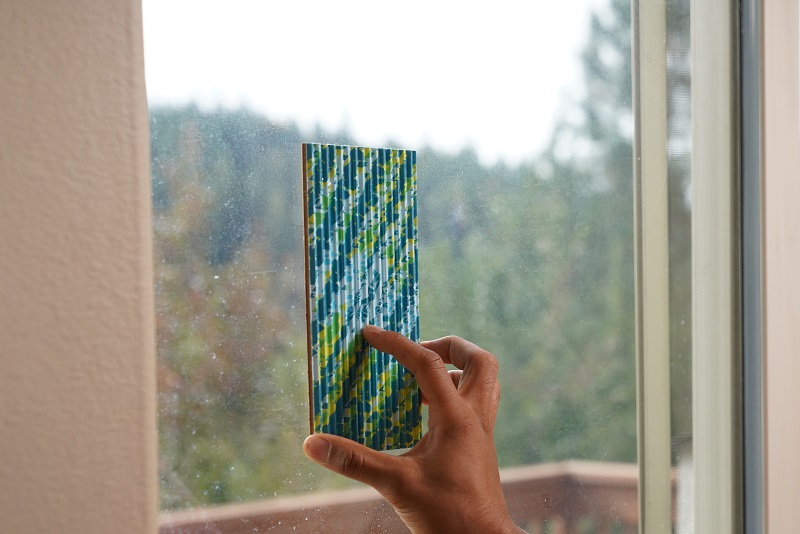 Attaching a RESCUE! FlyPad to a sliding door next to a kitchen