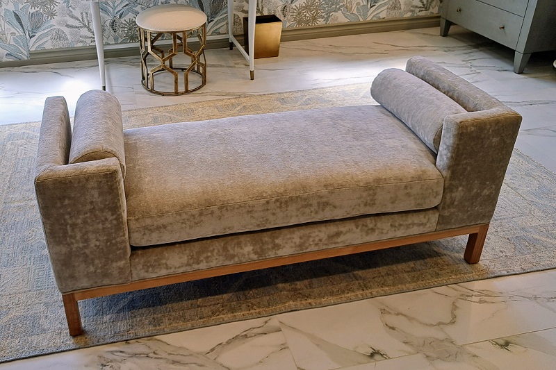 Plush velvet resting bench in the master bathroom in the 2024 Pasadena Showcase House