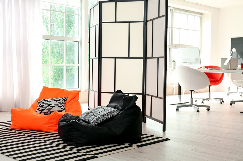 A productivity zone separated from a creativity zone with a room divider