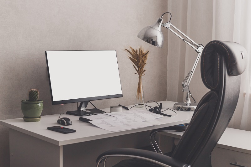 Small modern office desk with ergonomic desk chair