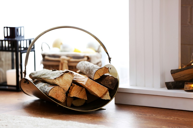 Small stack of logs placed near fireplace
