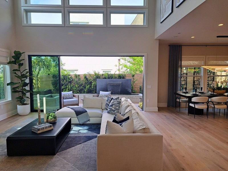 Home with large open space living area connected to outdoor patio exemplifies spatial harmony