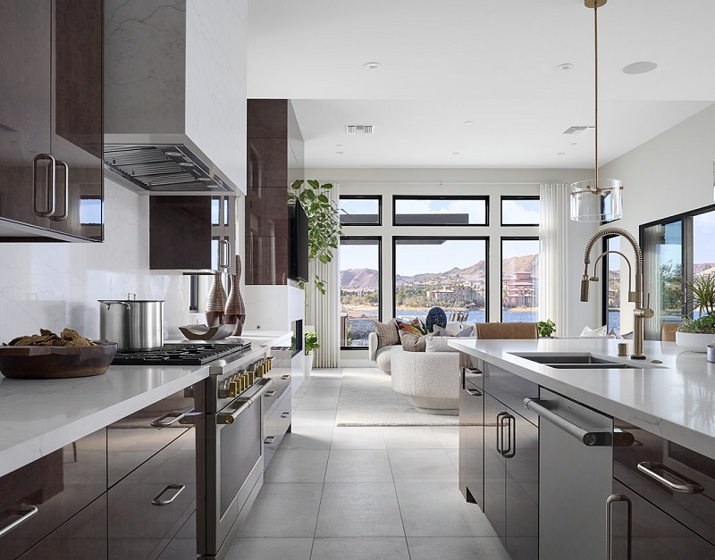 Luxury kitchen with natural light and views in a La Cova Plan 5 model. Photo courtesy of Damian Tsutsumida and Tri Pointe Homes.