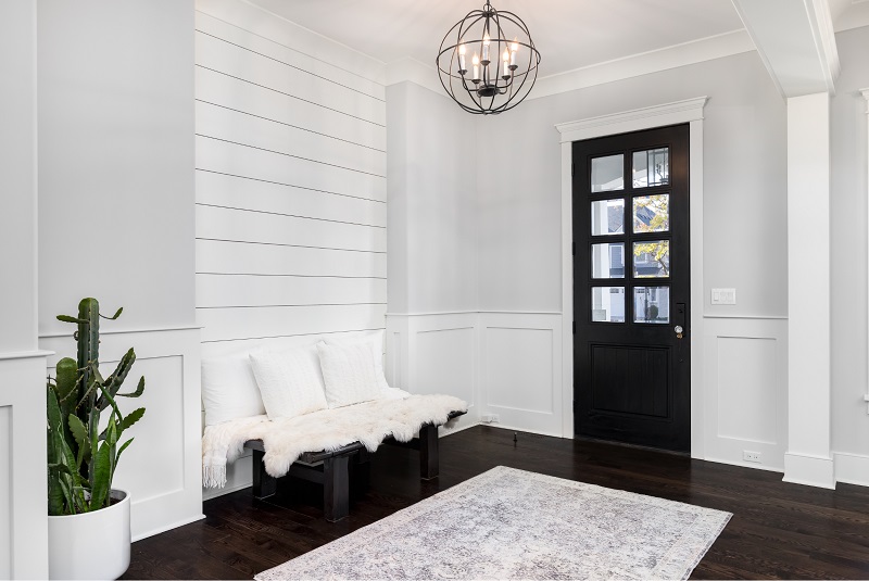 Newly installed light fixture in upgraded, stylish foyer