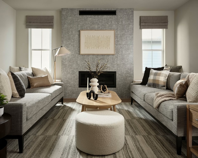 The living room of a Tri Pointe Homes model at their Painted Prairie community designed in Textural Neutral by Bobby Berk. Photo by Kara Mercer Photography