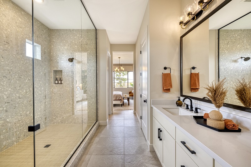 Primary bathroom of the Rosemary model, in the Zen Sanctuary Collection, designed by Bobby Berk, in the Tri Pointe Homes' Waterston Central community. Photo by Dustin Revella