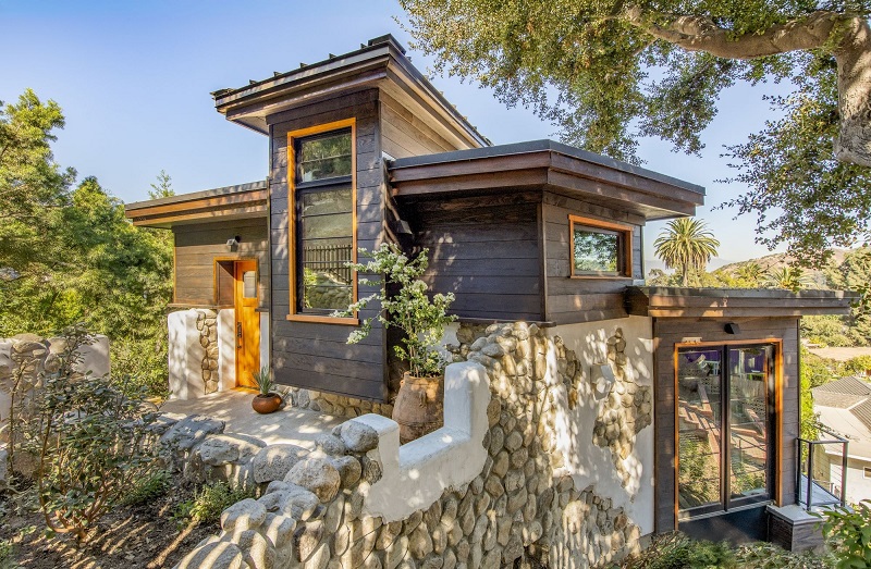Front elevation of Paraiso de Rocas Antiguas has an intimate front entrance by not needing a large area for a garage or parking space.