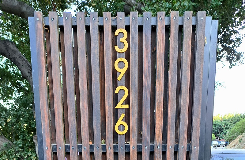 The stylish address number of the ADU's front gate that meshes perfectly with the neighborhood and timeless Craftsman style of the home