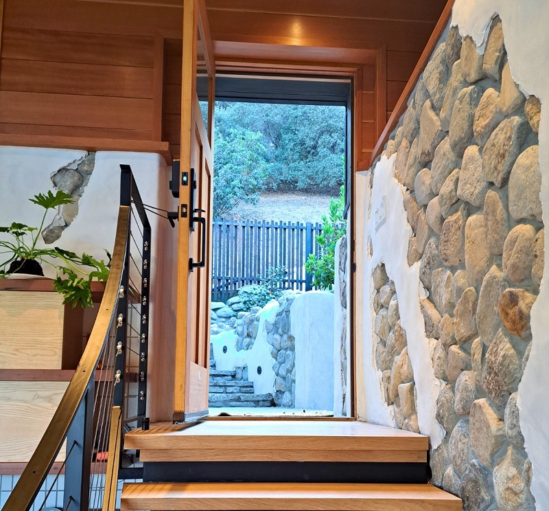 Reclaimed river rocks connect indoors with the outdoors