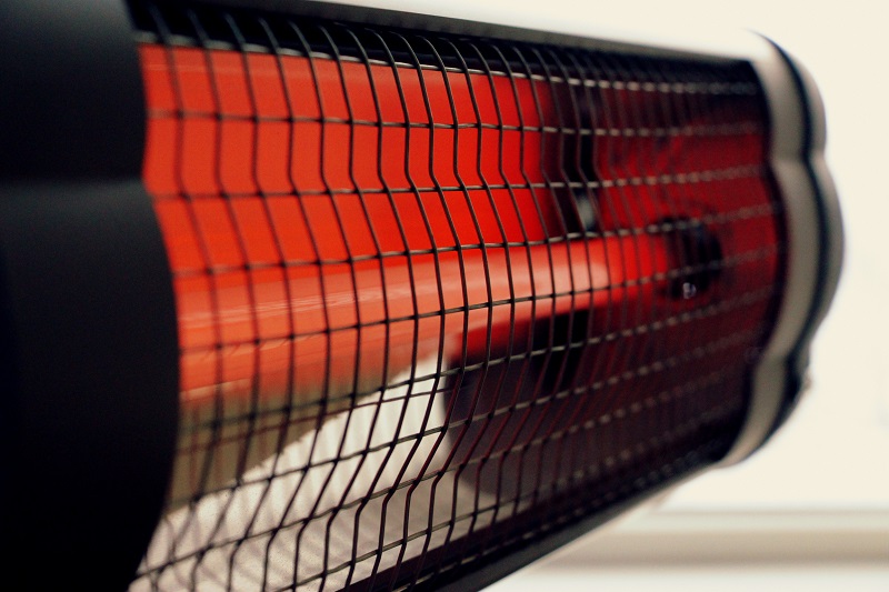 A wall-mounted infrared heater in a garage