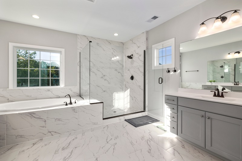 Bathroom with large durable, marble-looking porcelain tiles on floor and wall