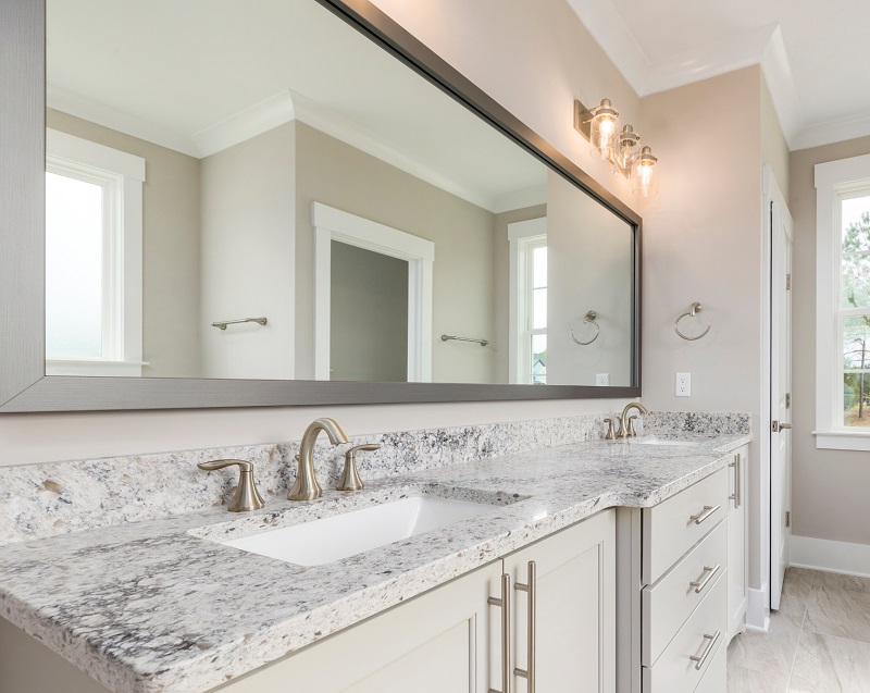 New bathroom with large mirror for double vanity