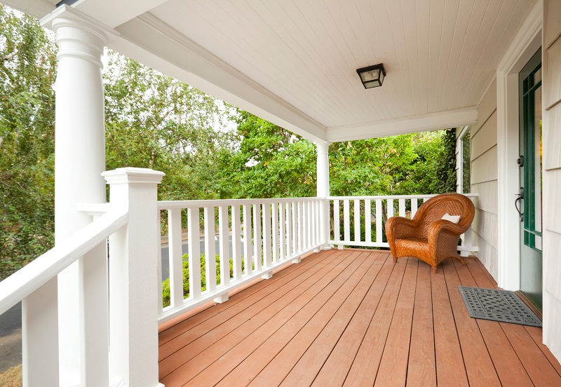 Large porch with white Doric columns and capitals