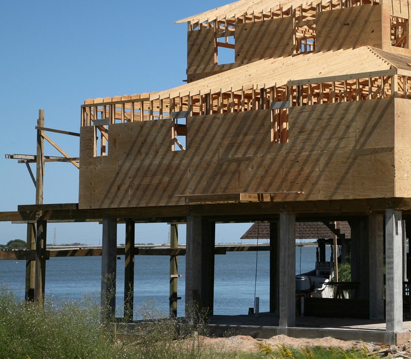 Home being constructed on stilts on Tiki Island, Texas