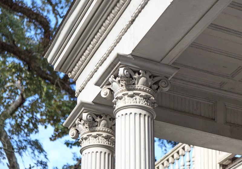 Ornate Corinthian columns and capitals on southern style mansion