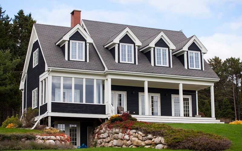 Cape Cod situated high above the roadway with pristine views