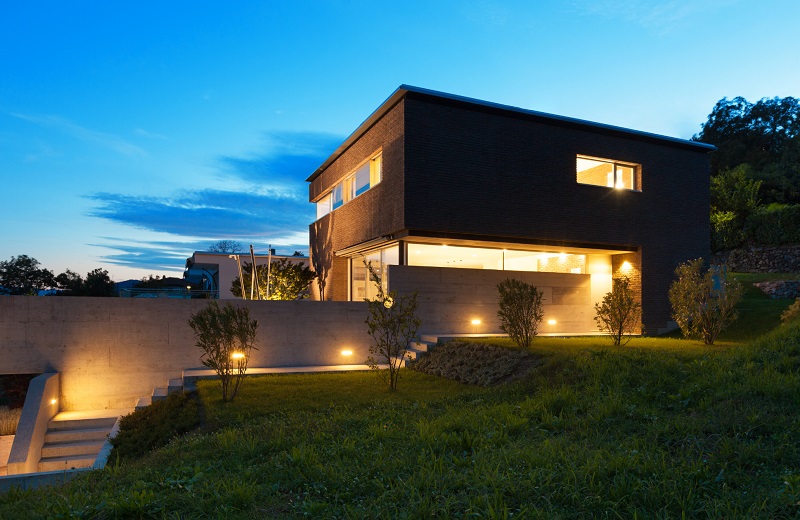 Modern home with down-lit outdoor stairway