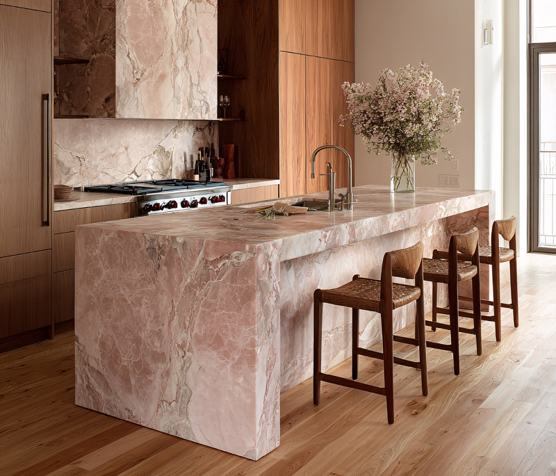 Modern kitchen with pink quartzite, paired with warm wood cabinetry and flooring
