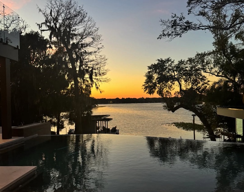 View of Lake Osceola and vanishing edge pool. Photo courtesy of Alair Homes Orlando