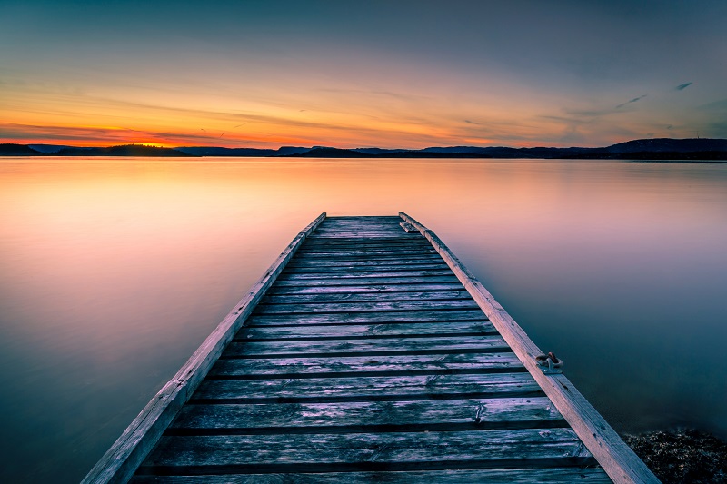 View of calm lake at sunset