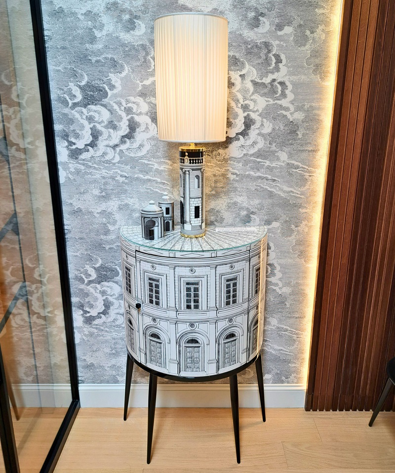 Fornasetti curved Palazzo side table on display at the Ricca Deisgn Los Angeles showroom