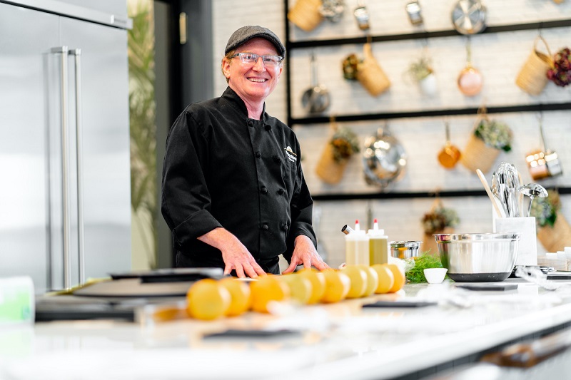 Friendly cooking instructor hosting a cooking event at Amblebrook at Gettysburg