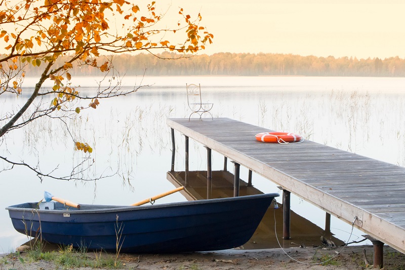 Sturdy private pier with blue rowboat