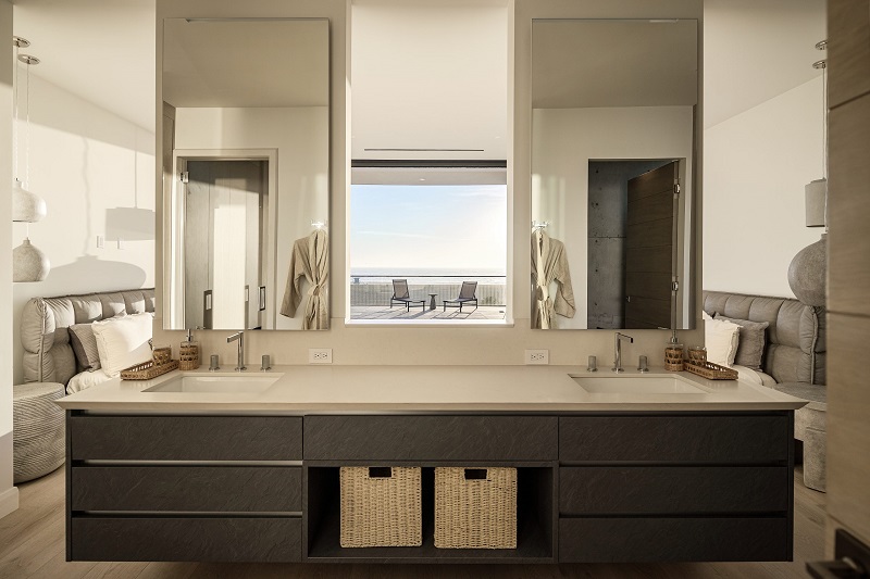 Elegantly modern master bath suite by TM Italia expertly designed with modern lines and luxurious textures with a soothing view of the Pacific ocean from this beachfront home in Santa Monica, California
