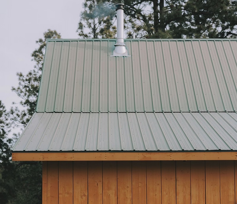 Cabin listed on Vrbo for the Durango, Colorado market, with new metal roof and attractive exterior wood planks