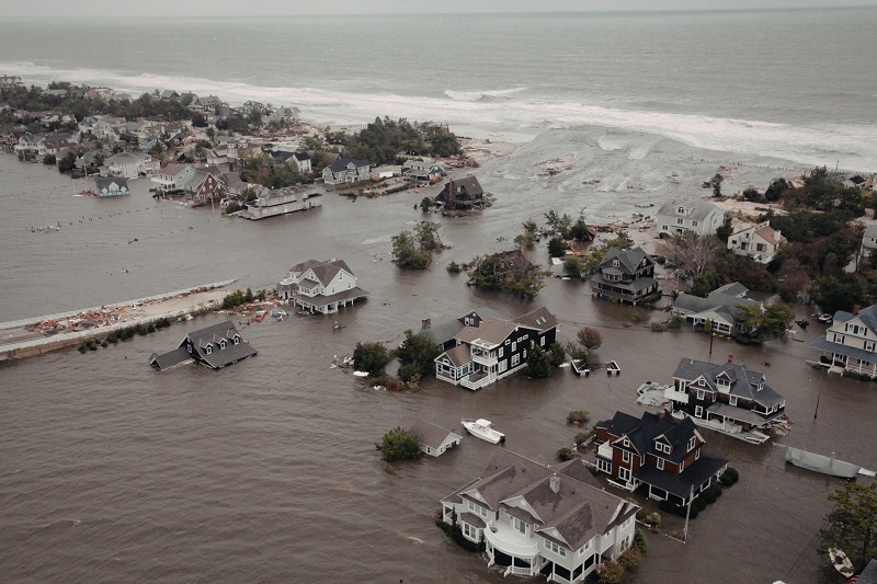 Aerial view of a coastal town submerged by floodwaters