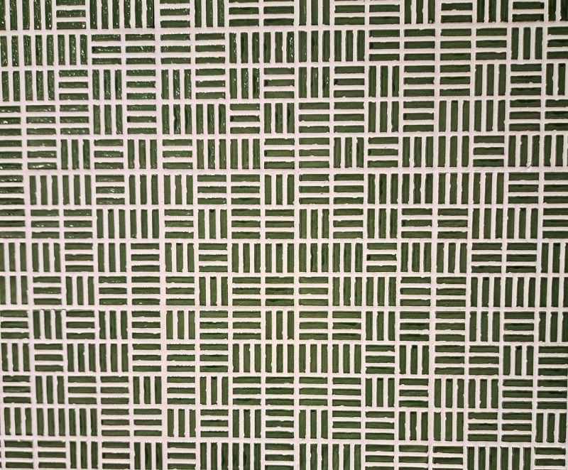 Green geometric pattern with texture exhibited by APE Grupo at Coverings 2026
