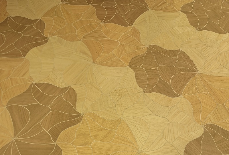 View of the intricate Blooming Parquet porcelain tile flooring by Gionvanni Barbieri exhibied by MILEstone at Coverings 2026