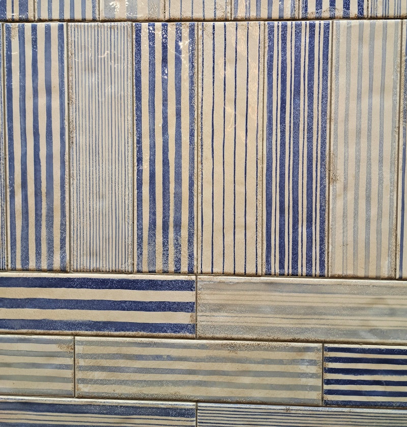 Close up view of long style tiles exhibited by Merola at Coverings 2026