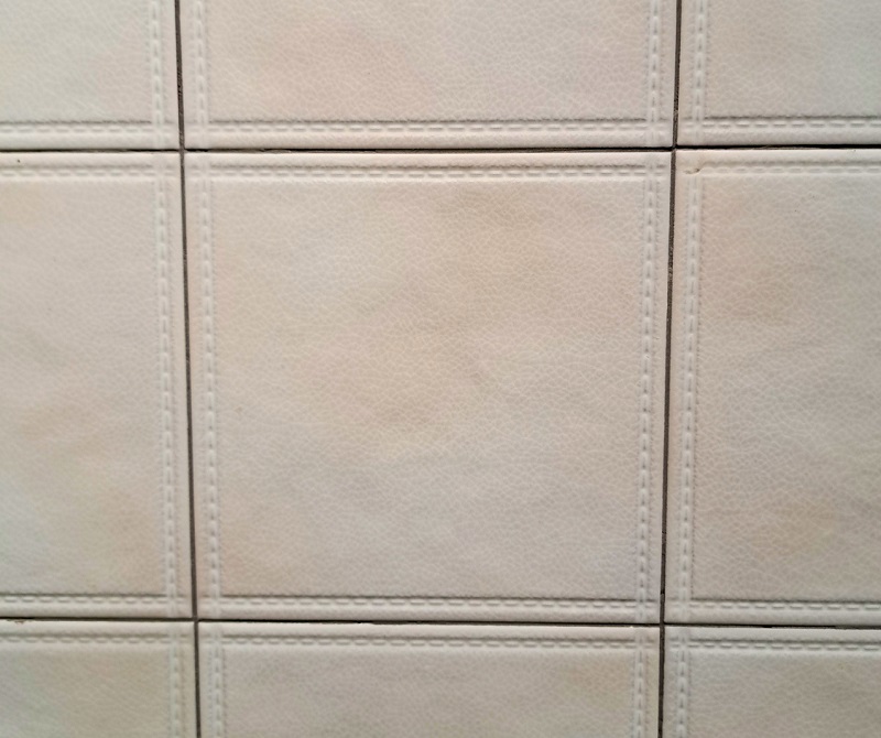 Close up view of an example of tailored craft tile that looks like leather exhibited by Merola at Coverings 2026