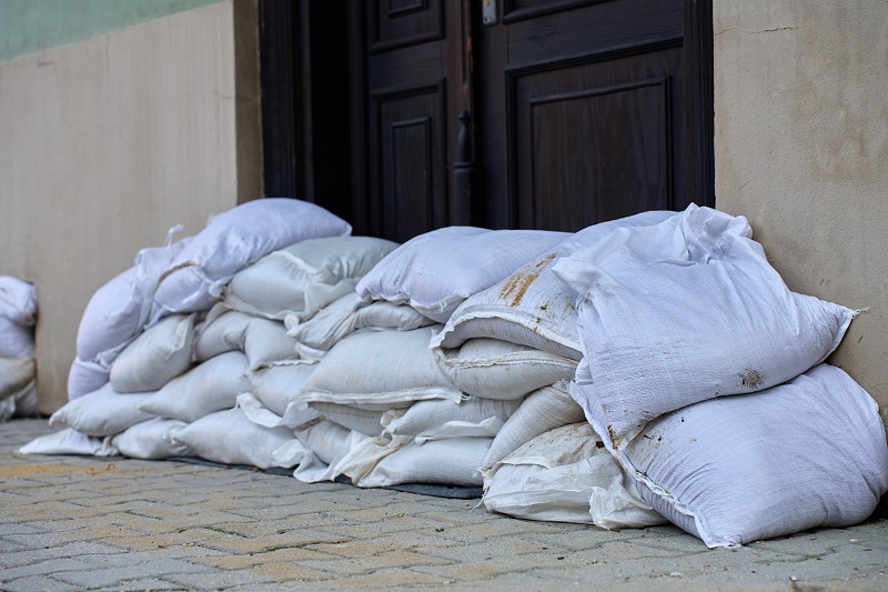Florida home with large sandbag wall for flood protection