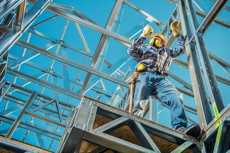 Construction worker working on a steel-framed home