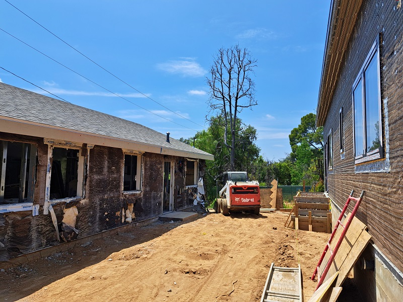 Lytemods' Altadena rebuild construction site view of original ADU in the process of being refurbished behind the main house