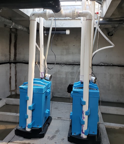 BioMicrobics BioBarrier residential installation — submerged ultrafiltration membrane technology, scaled for single-family home use. Image: BioMicrobics