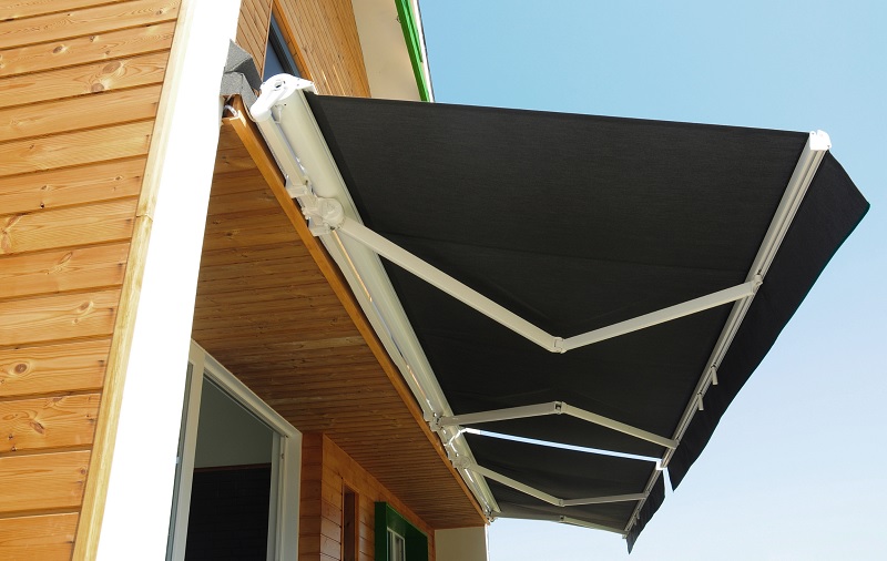 Retractable awning attached to beachfront property