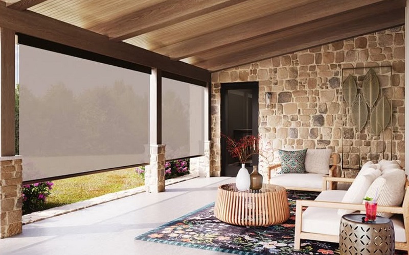 Solar shades drawn in large enclosed veranda