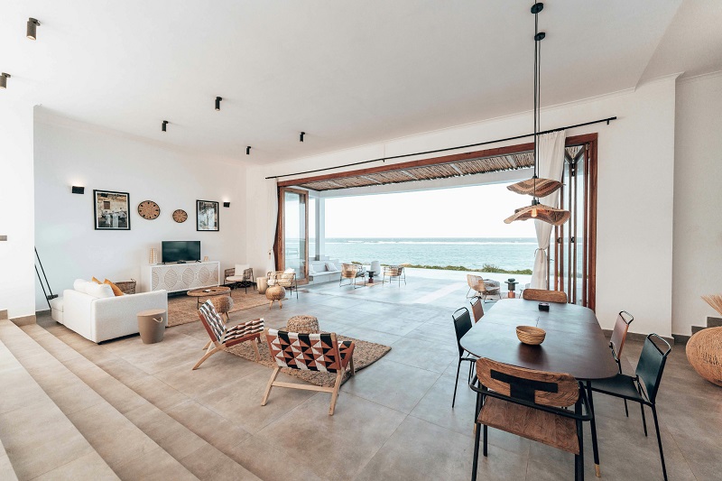 Waterfront home with zero-threshold folding doors