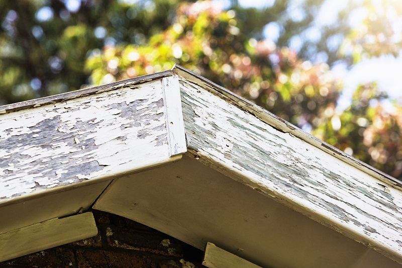 Worn, cracking roof timbers at the corner of barge boards