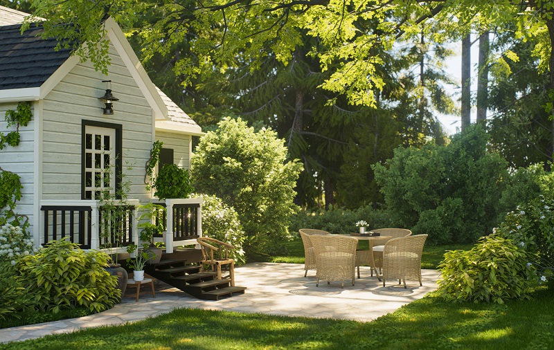 Cozy backyard patio with wicker furniture