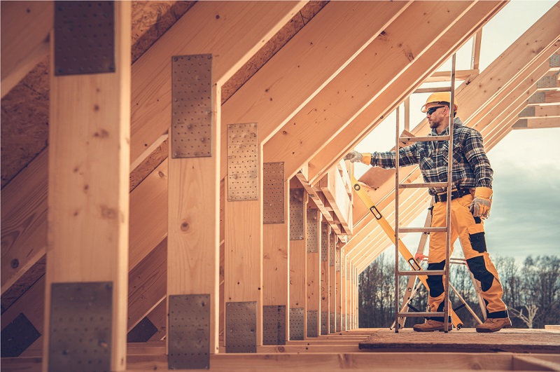 Rural home being built with wooden framing